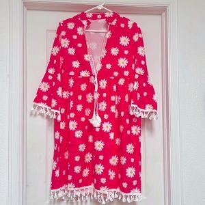 Medium hot pink and white dress with ties on the top.